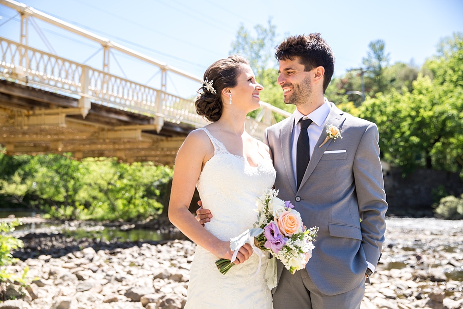 Rustic Red Mill Museum Wedding bride and groom on river bank