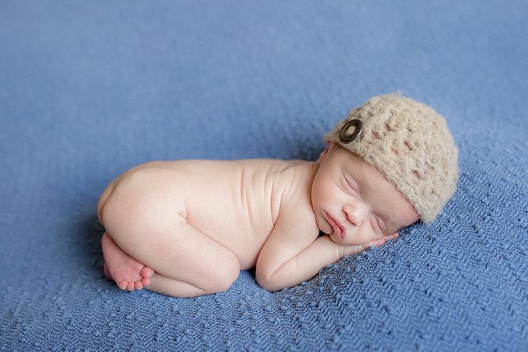 Newborn baby on blue blanket