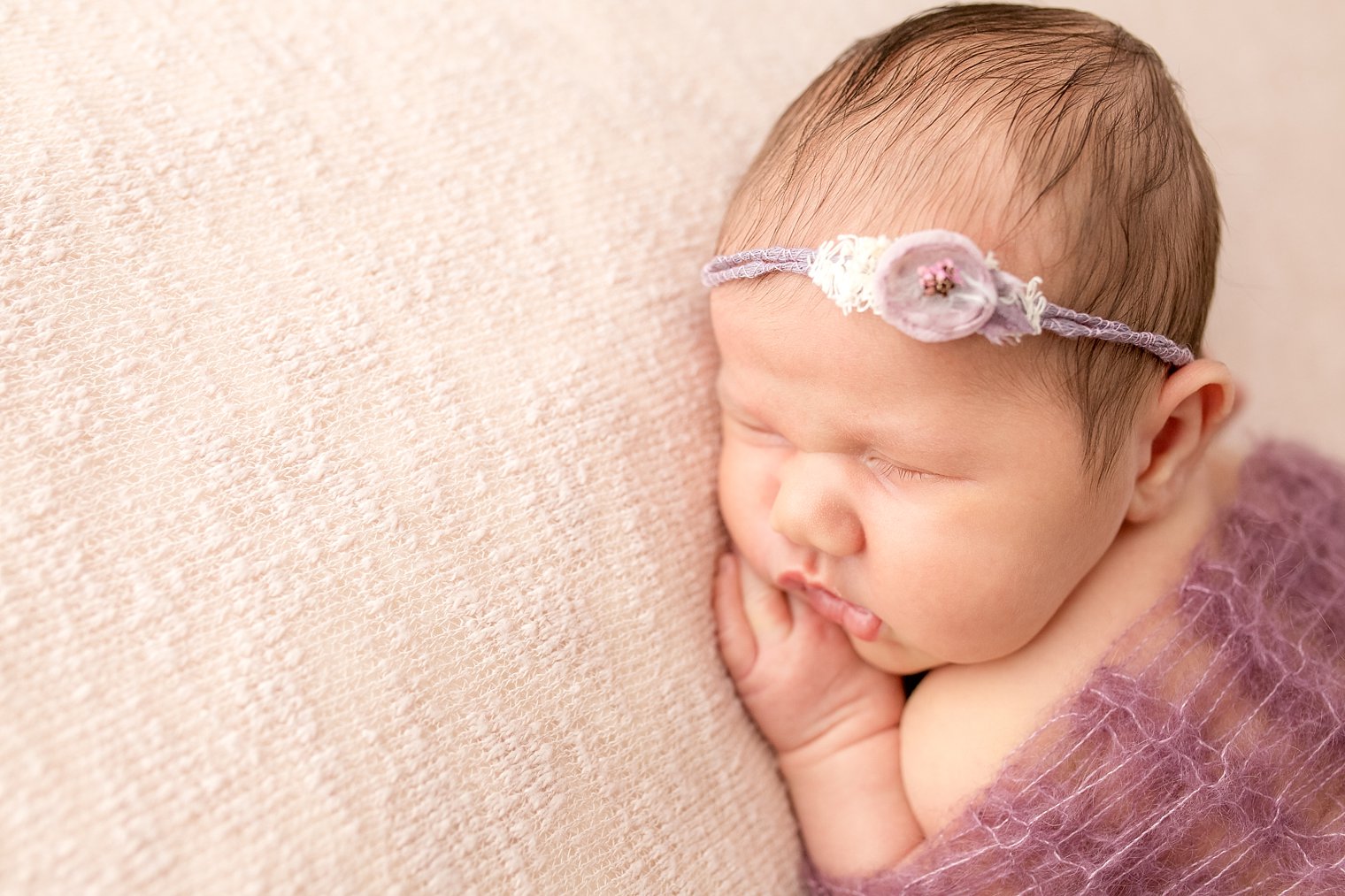 Newborn in headband from Itsy Bitsy Blooms