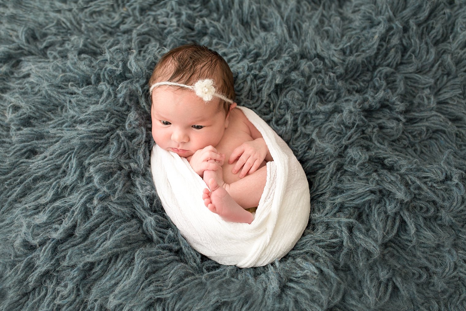 Photo of newborn on flokati fur