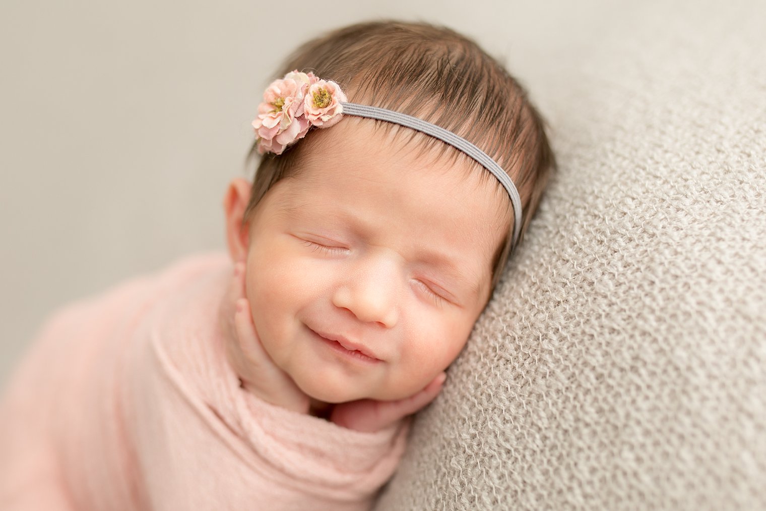 Smiling newborn baby girl photo