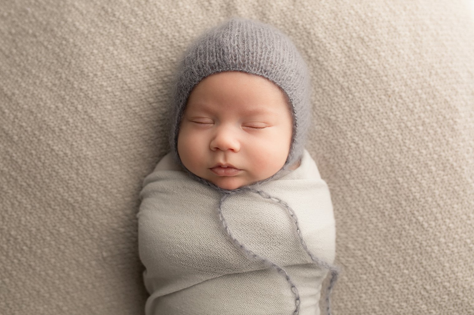 Central NJ Newborn Photographers baby in gray hat photo