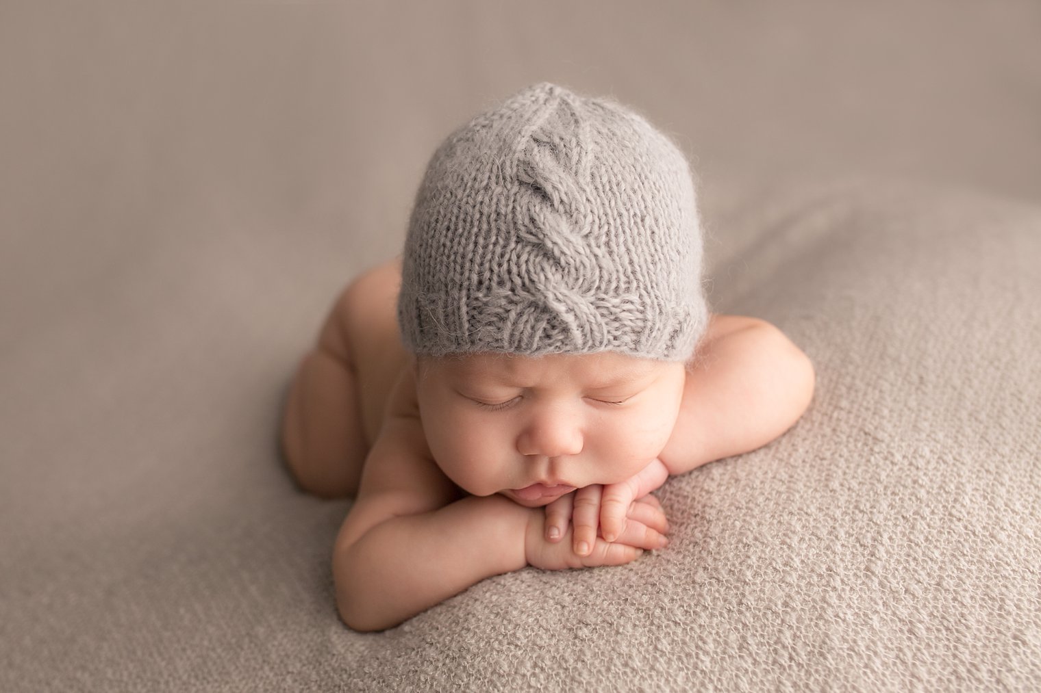 Central NJ Newborn Photographers boy in chin on hands pose