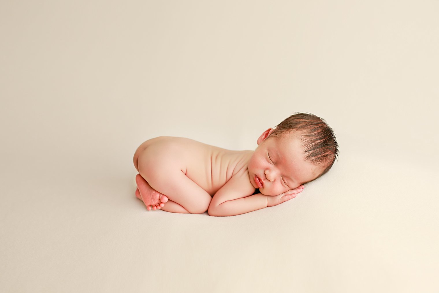 Manalapan NJ Newborn Photographer baby boy on cream blanket