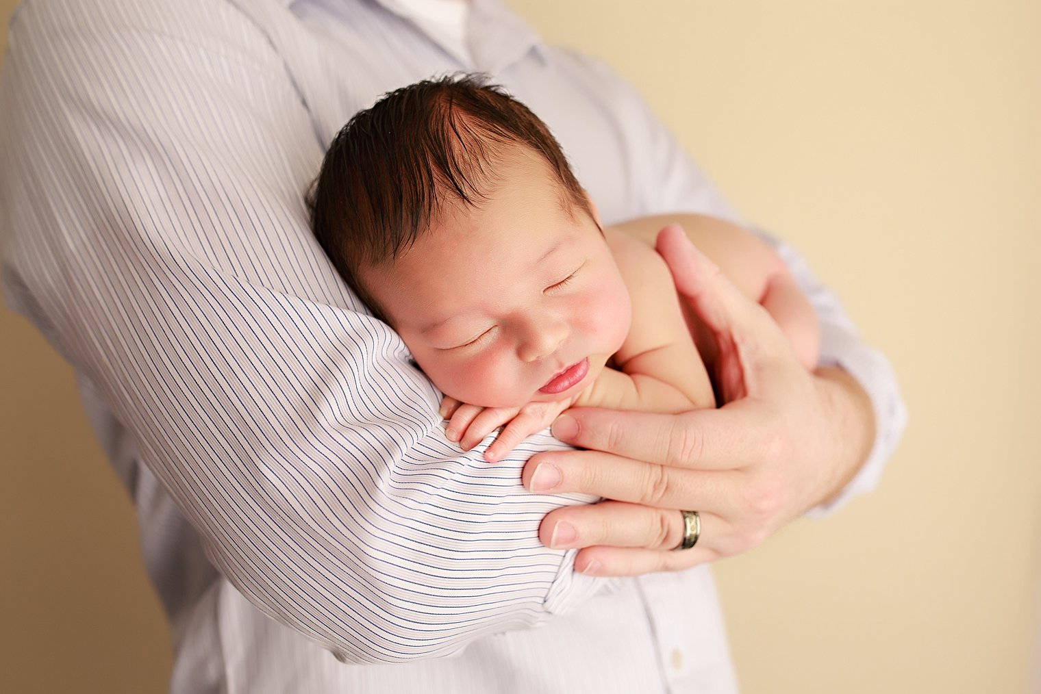 Manalapan NJ Newborn Photographer baby in father's arms