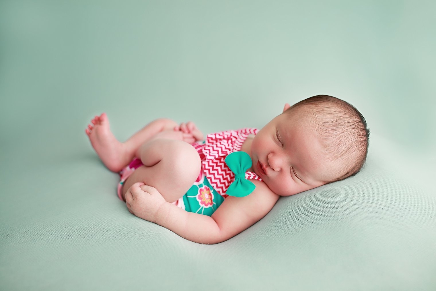 newborn girl in bathing suit