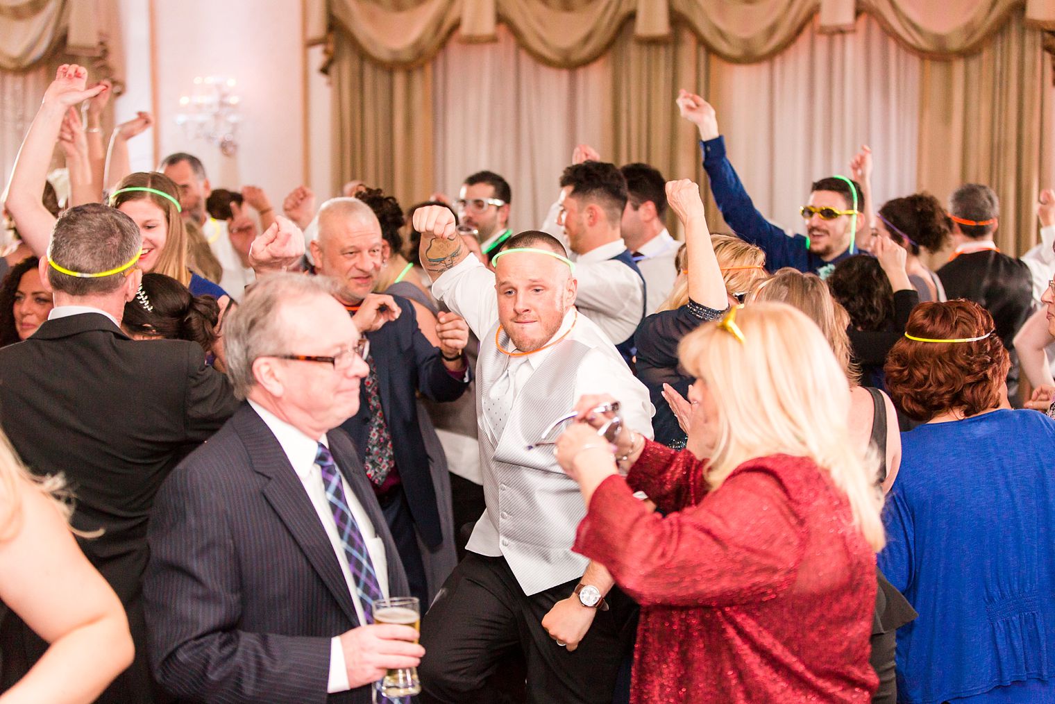 Fun groom dancing photo