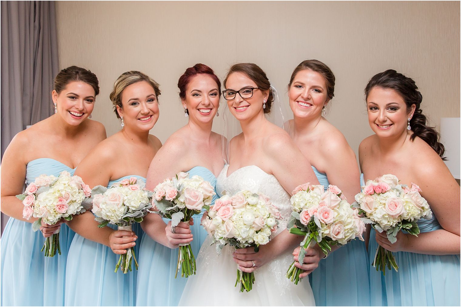 Bridesmaids with bouquets by Monday Morning Flower & Balloon Co.