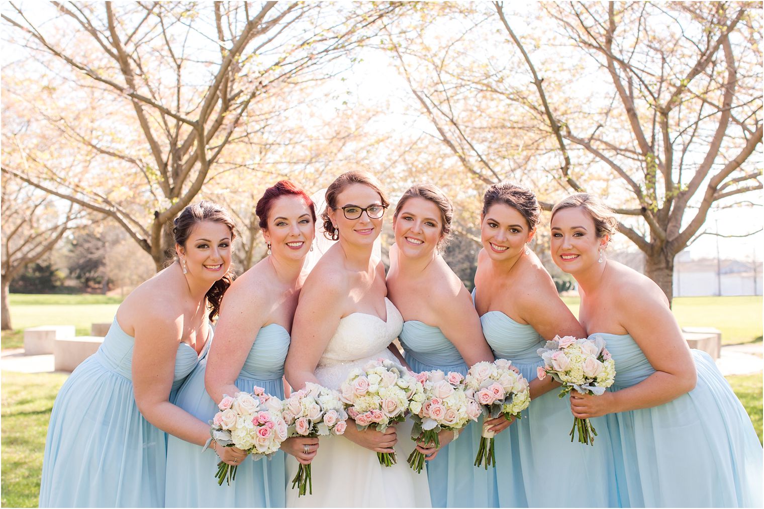 Bridesmaids in blue Bill Levkoff dresses