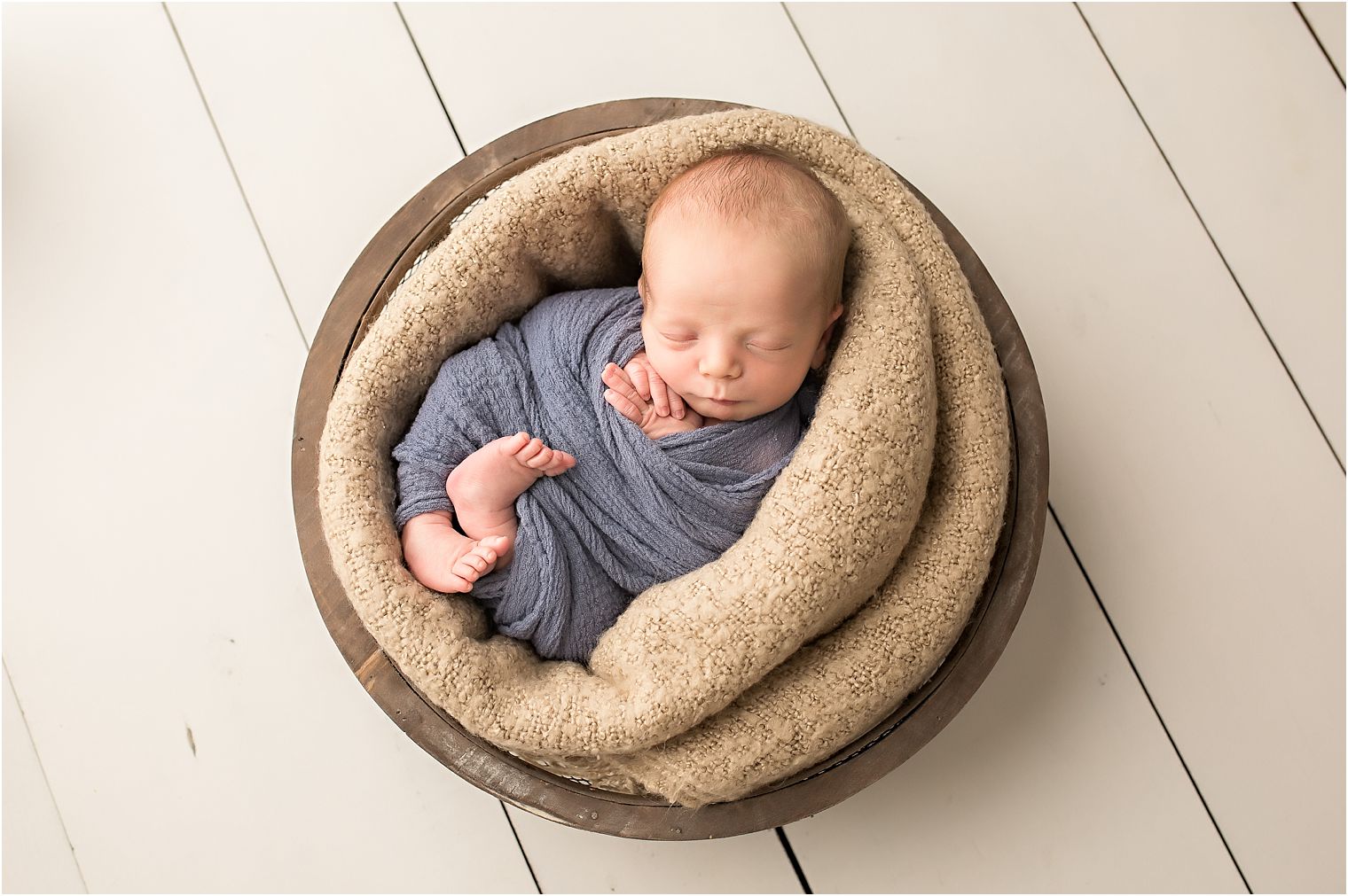 Newborn boy in basket