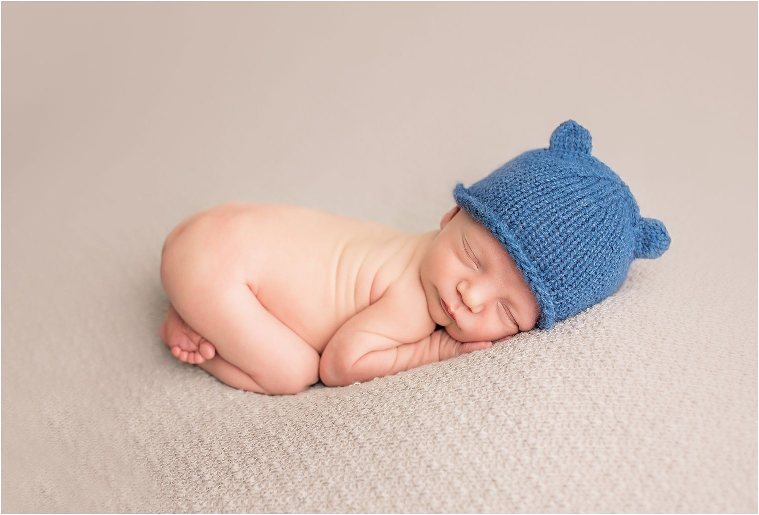 Newborn baby boy with knit hat
