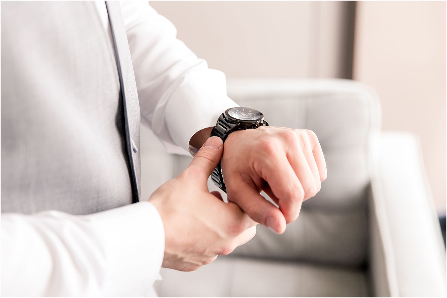 Groom putting on watch