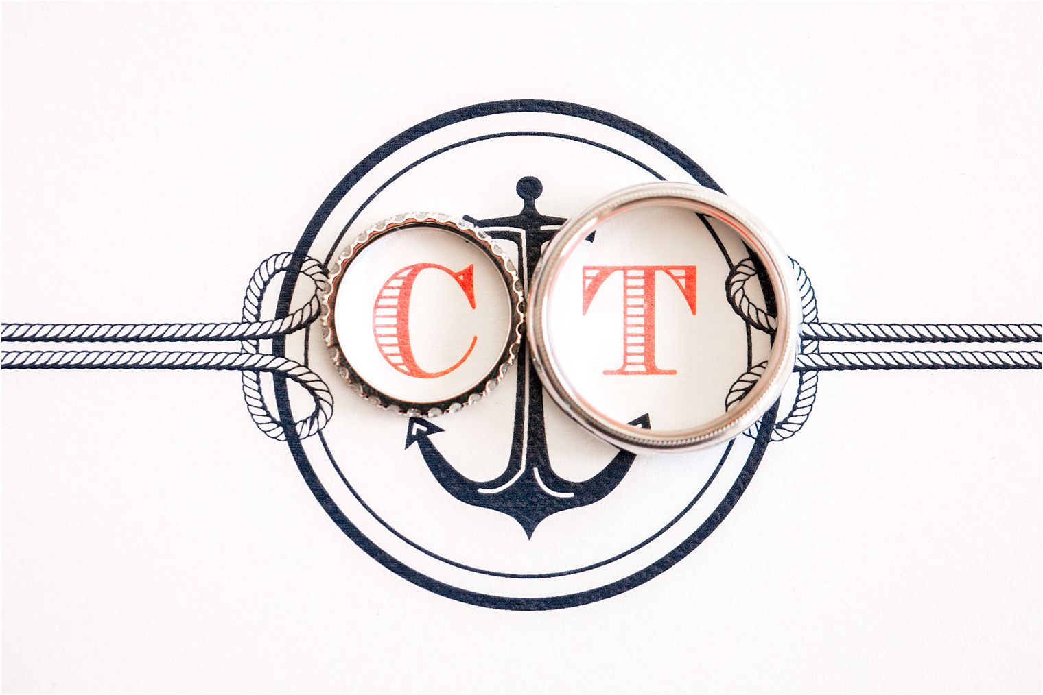 Nautical monogram on wedding invitation
