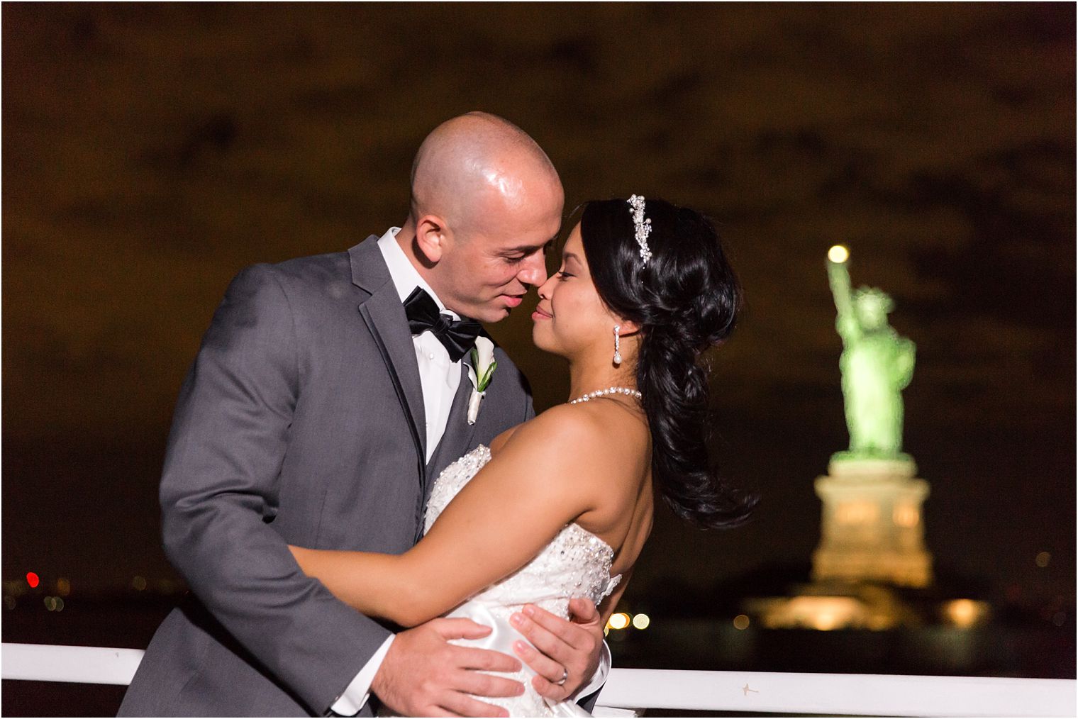 Bride and groom at Statue of Liberty