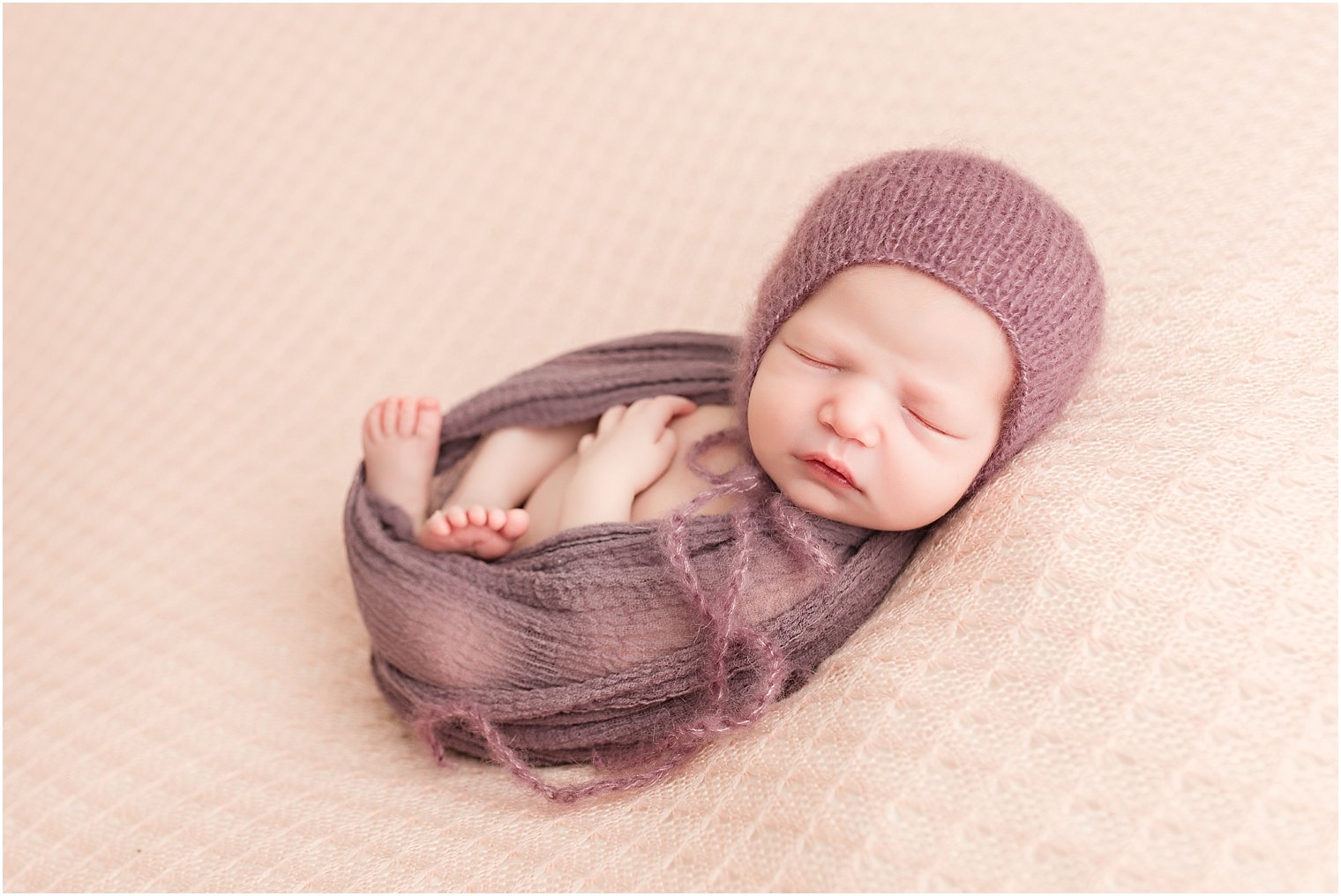 Newborn in pink and purple