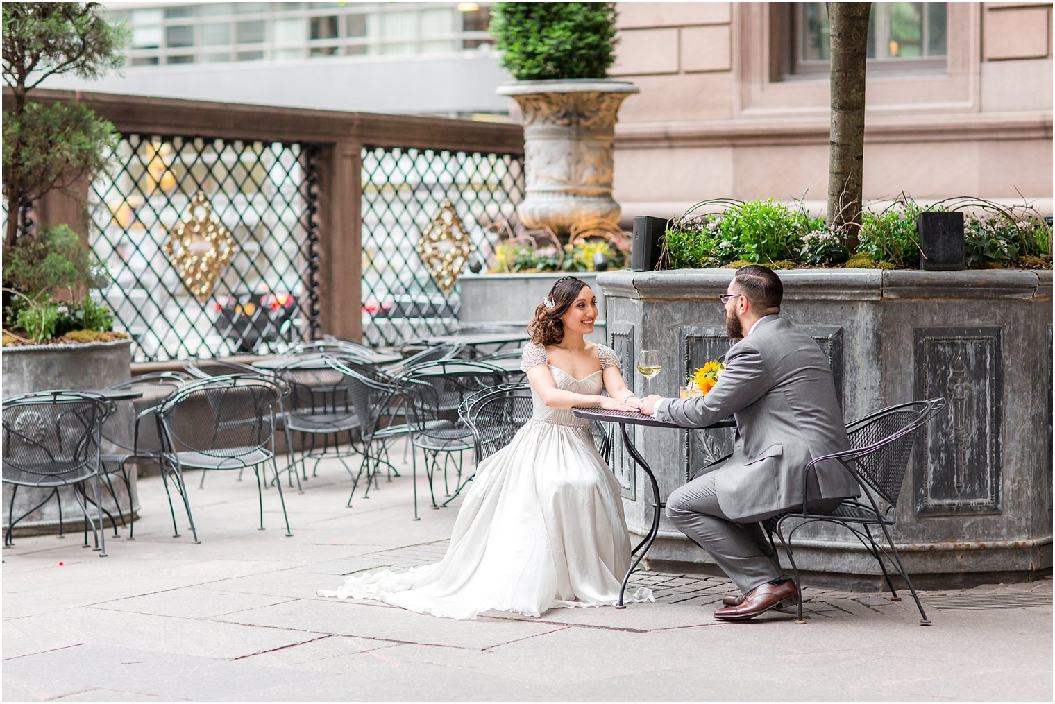 Bride and groom at New York Palace Hotel courtyard