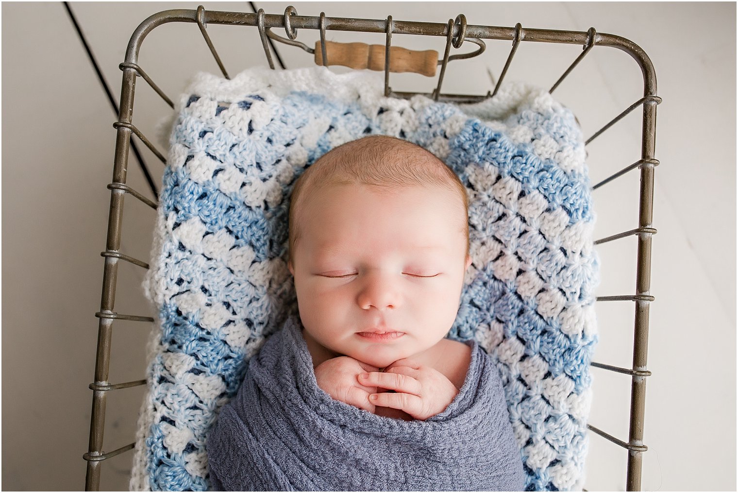 Baby with knit blanket