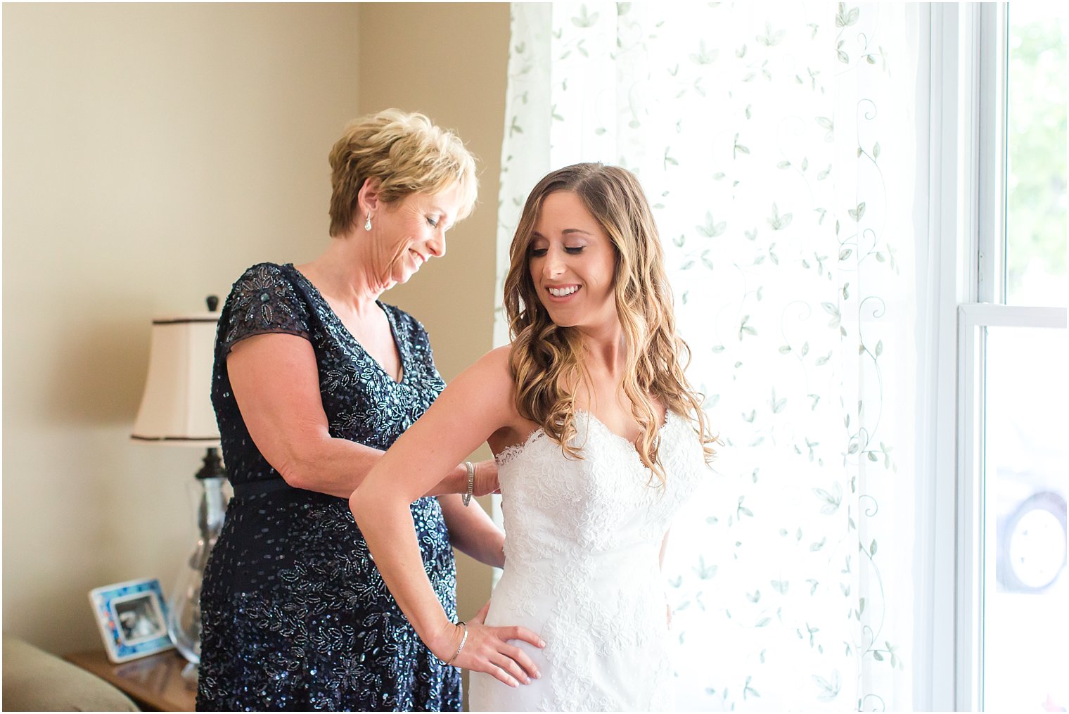 Bride getting ready with her mother