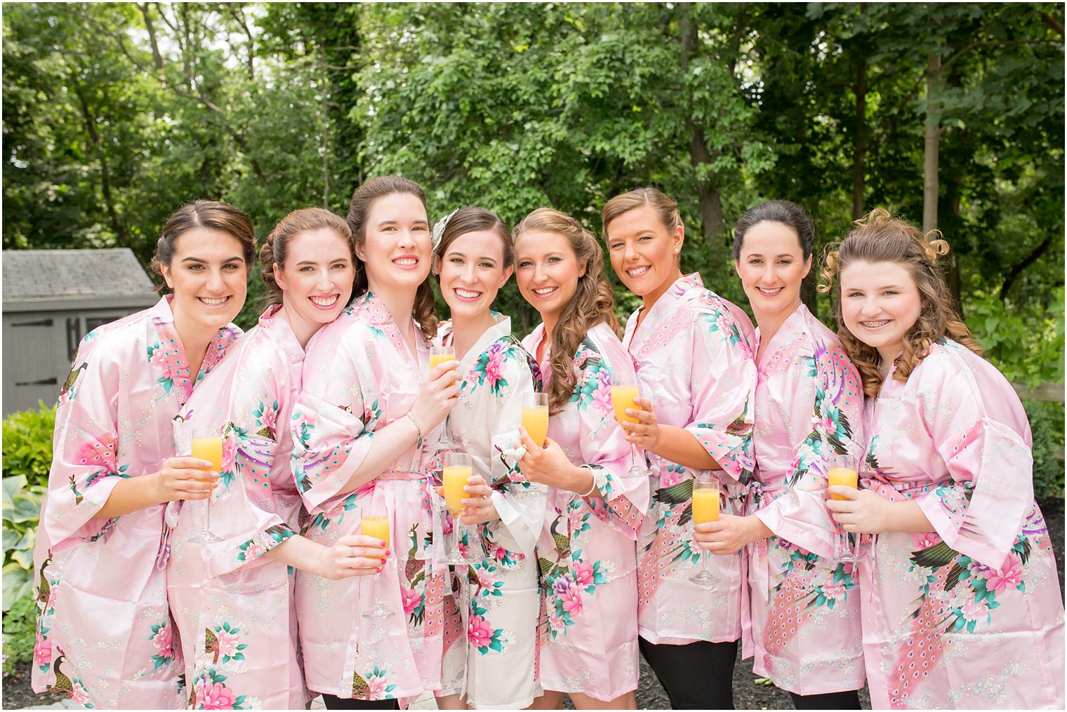 Bridesmaids in pink robes