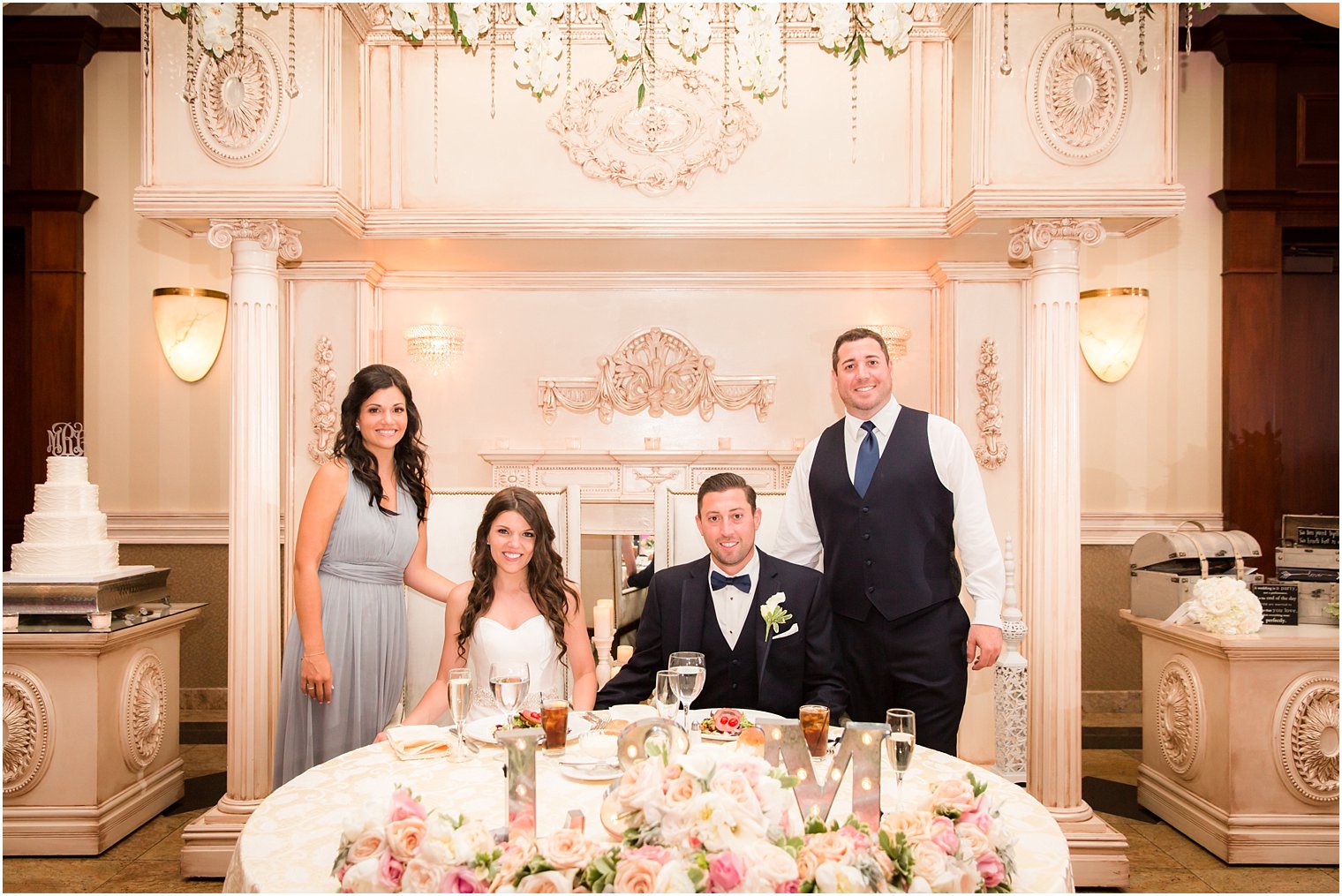 Bride and groom with best man and maid of honor