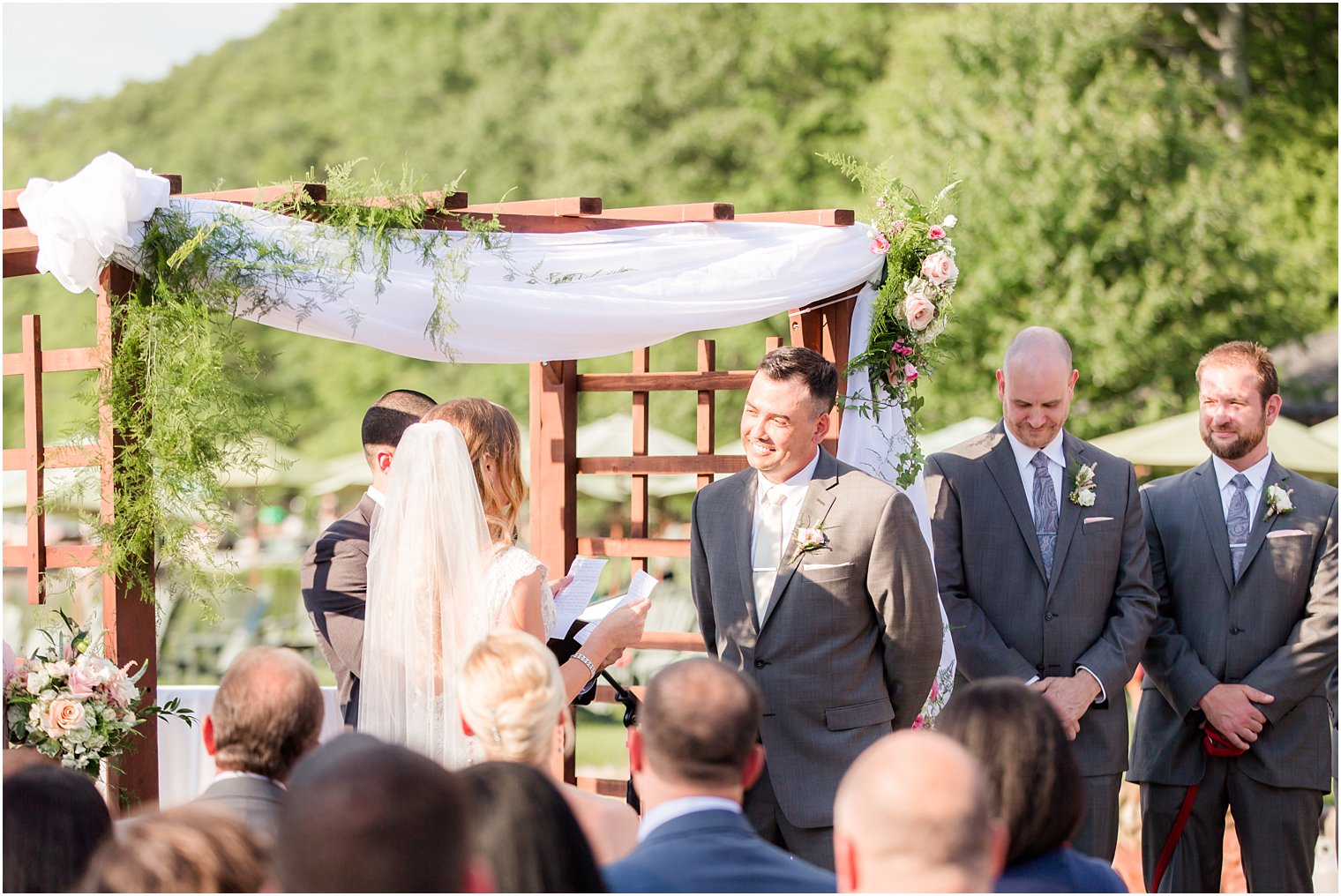 Smiling groom during ceremony