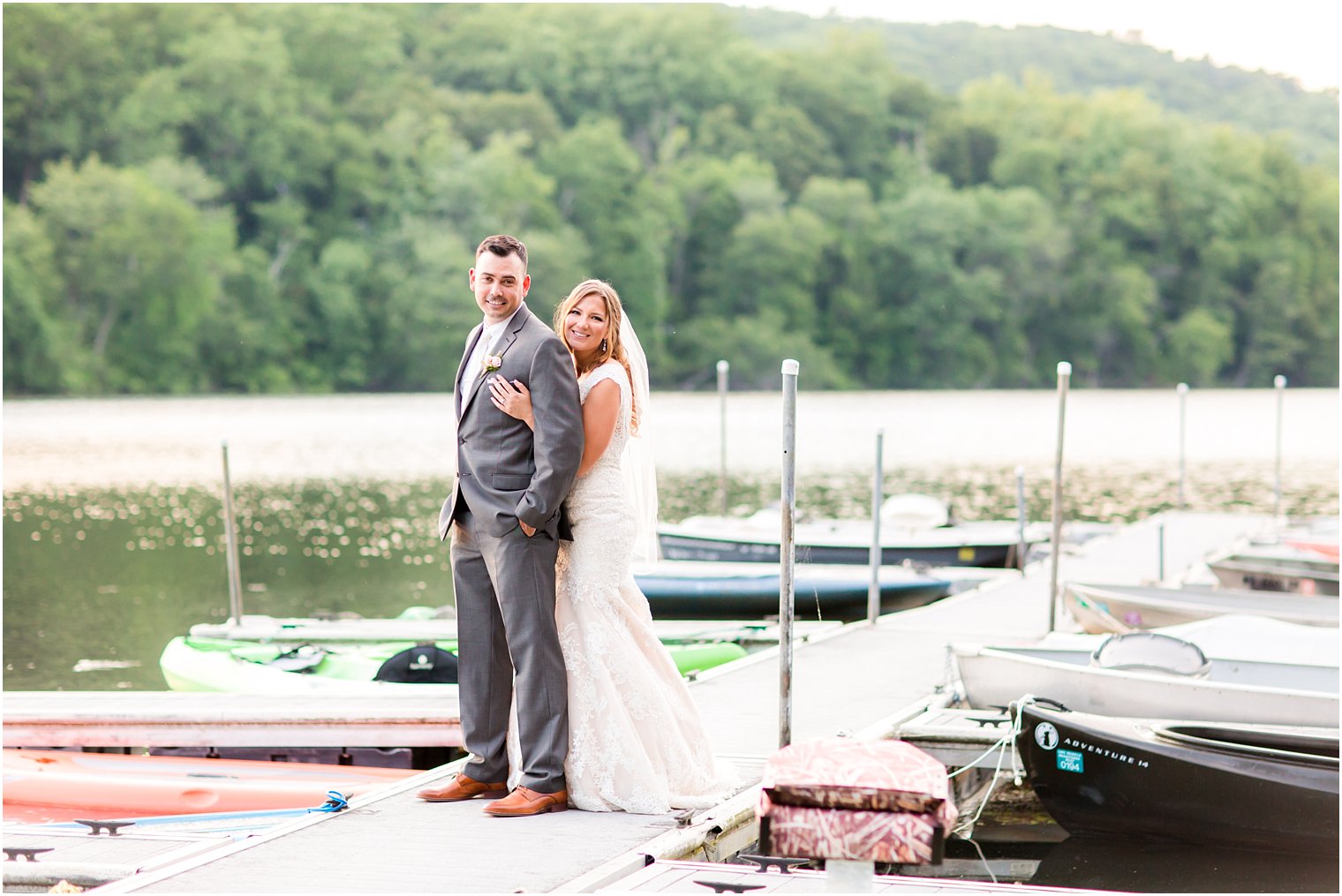 Bride and groom on dock