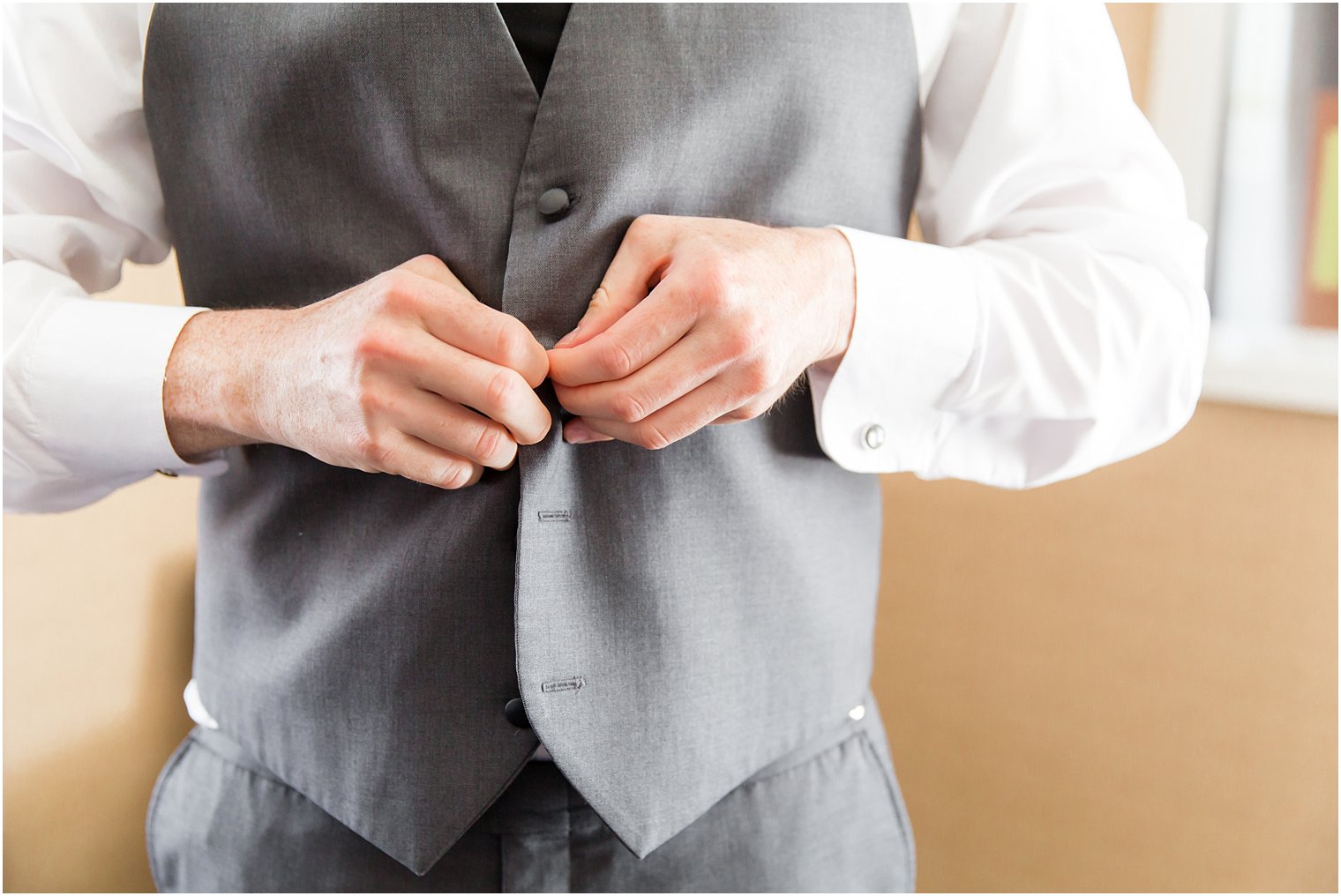 Groom in gray suit