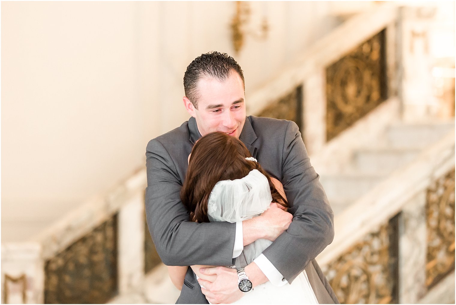 Emotional groom at first look