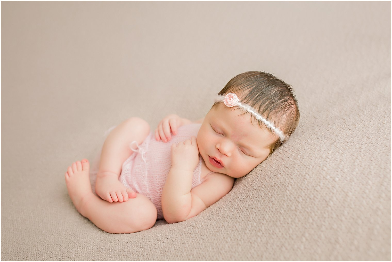 Newborn in pink mohair romper