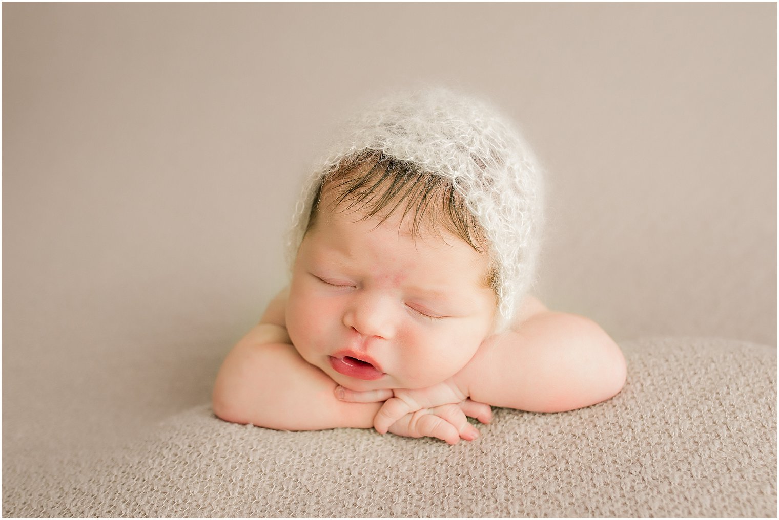 Newborn baby with mohair hat