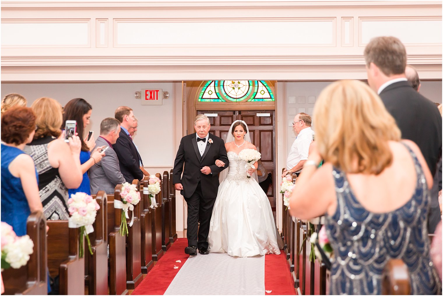 Bride walking down the aisle with her father