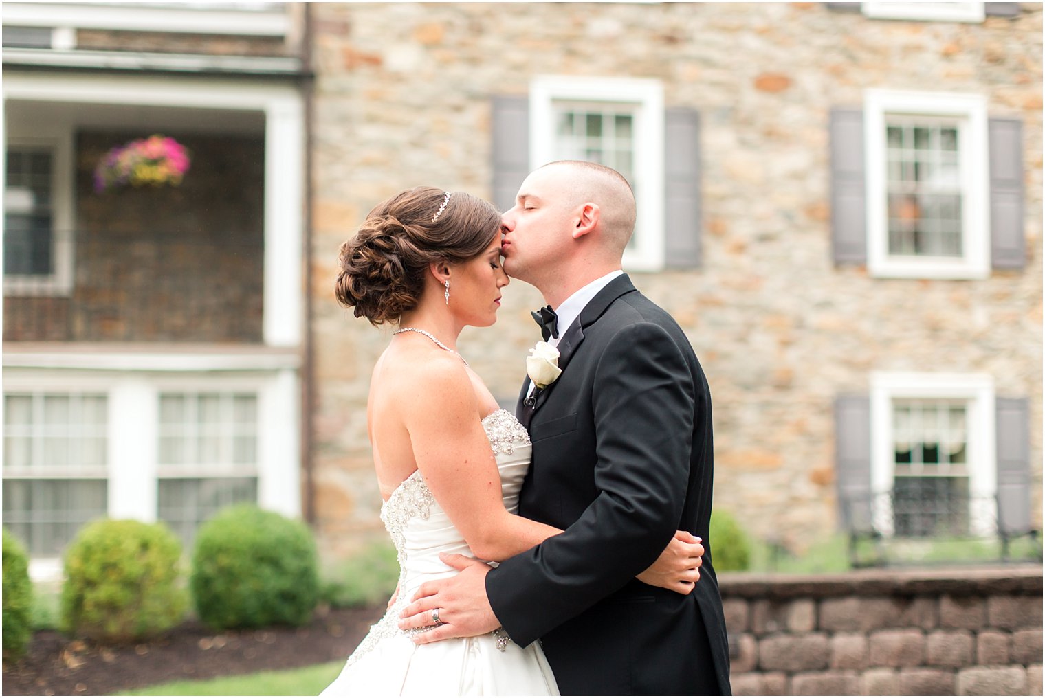 Forehead kiss on wedding day
