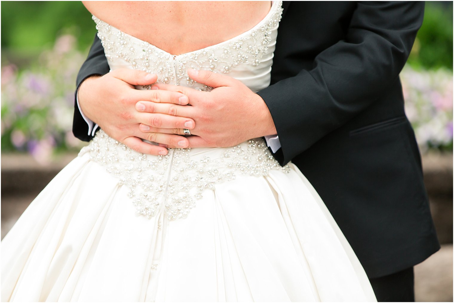 Groom holding his bride