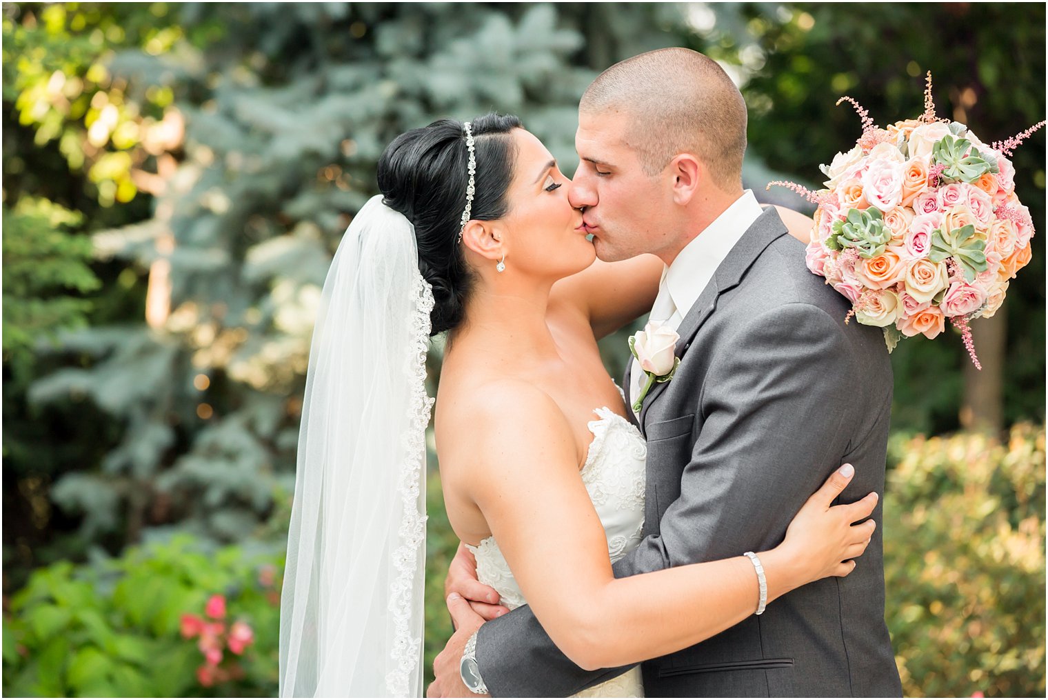 Bride and groom kissing 