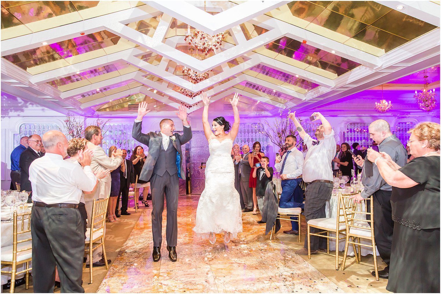 Jumping bride and groom