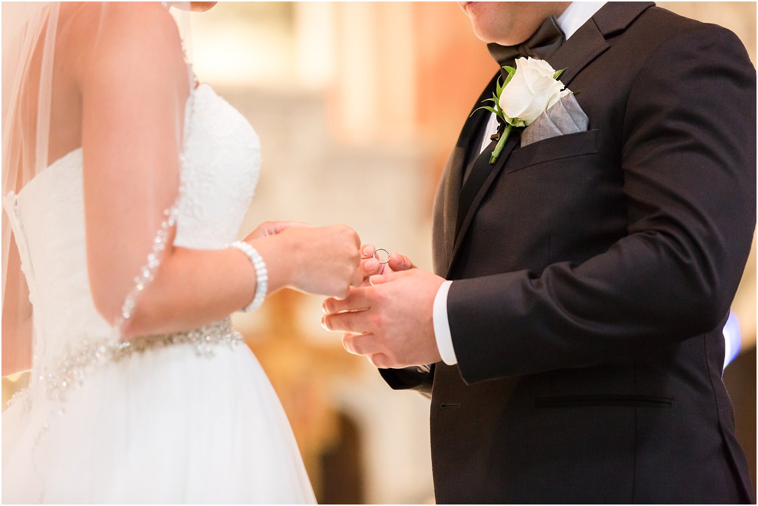 Ring exchange during Catholic ceremony