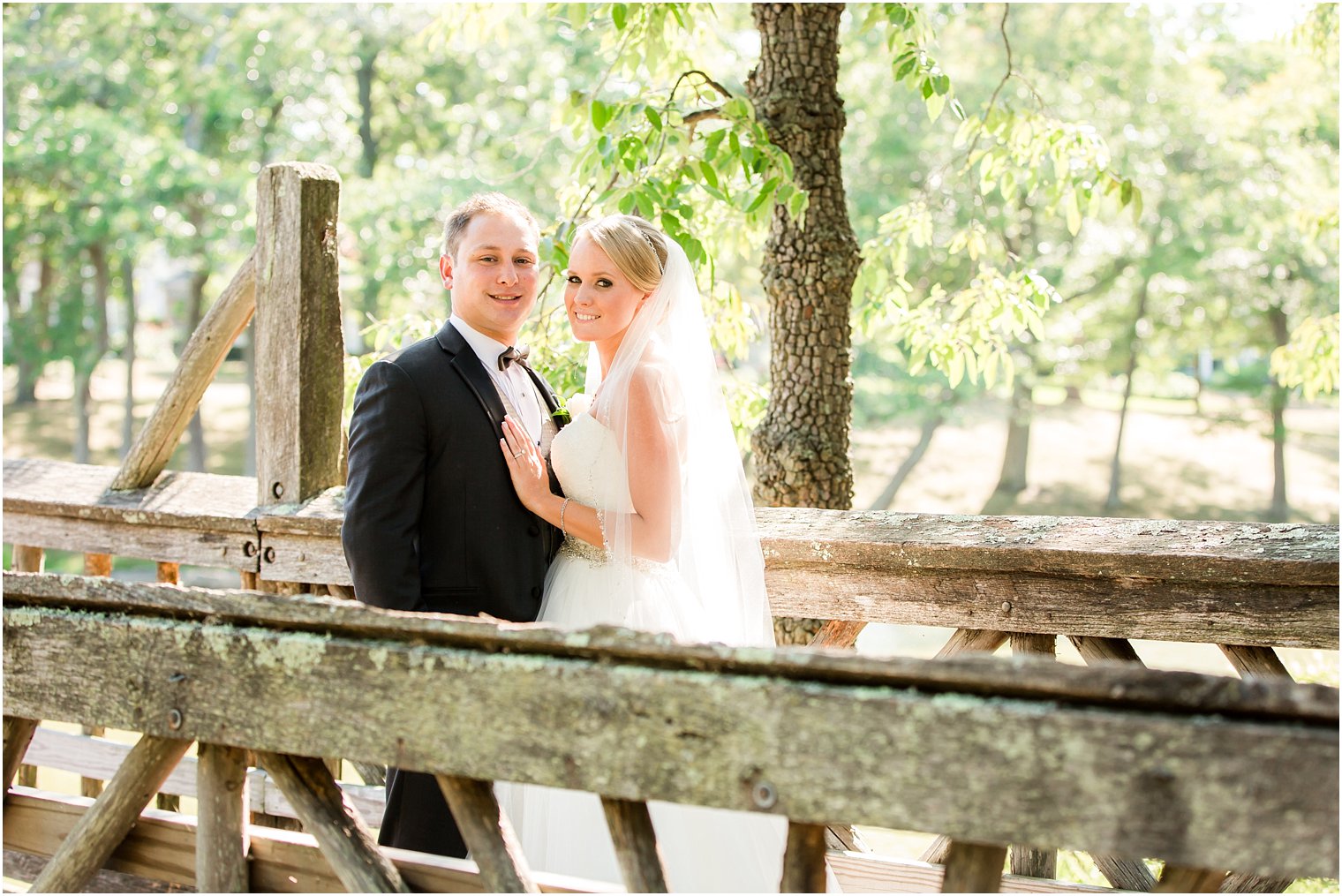 Bride and groom on bridge