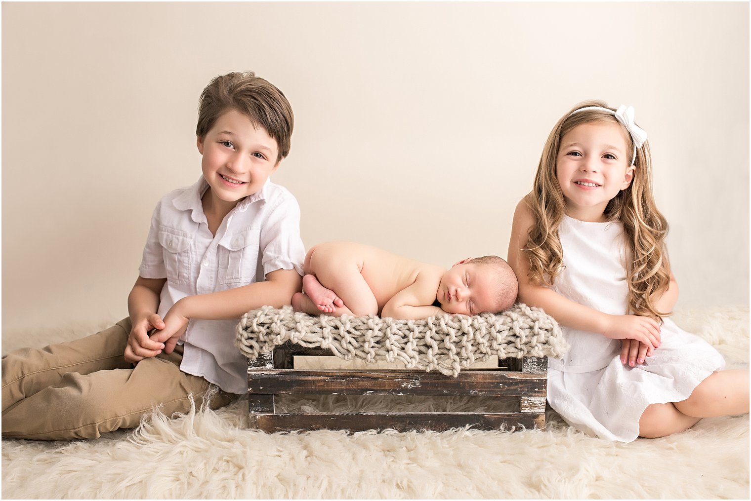 Tushie-up on Crate with Siblings Newborn Pose