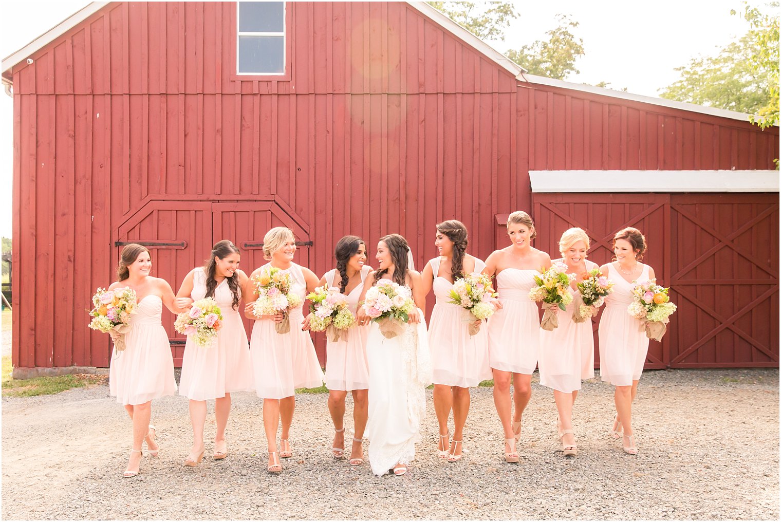 Bridesmaids in pink Bill Levkoff dresses