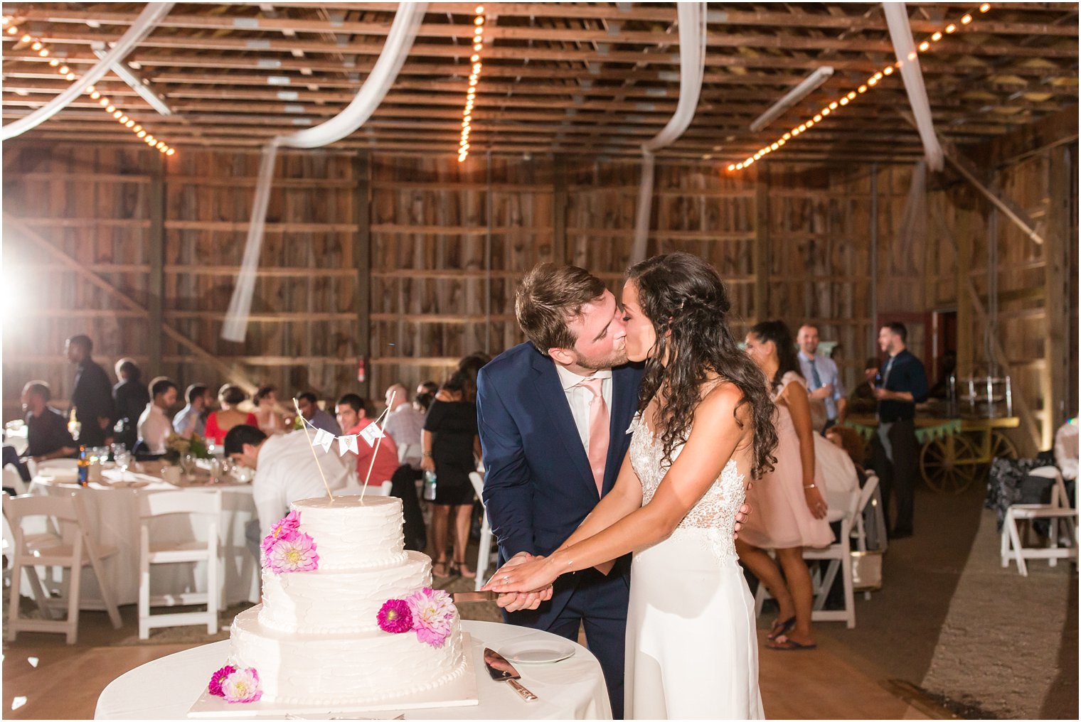 Bride and Groom cut their wedding cake