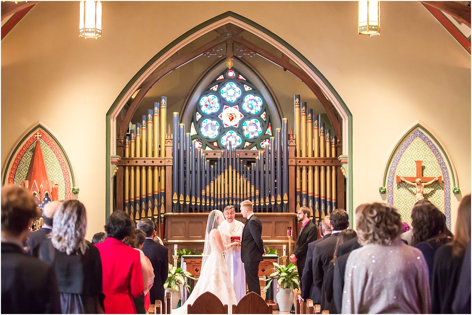 Bride and groom exchange wedding rings