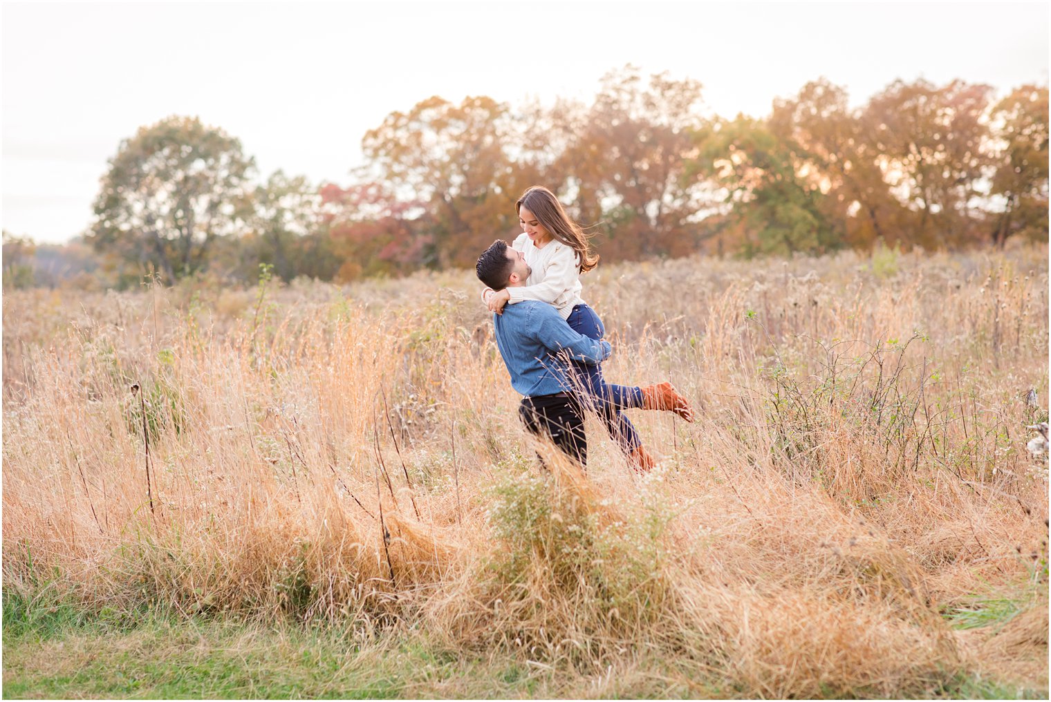 Groom lifting bride at Natirar Park