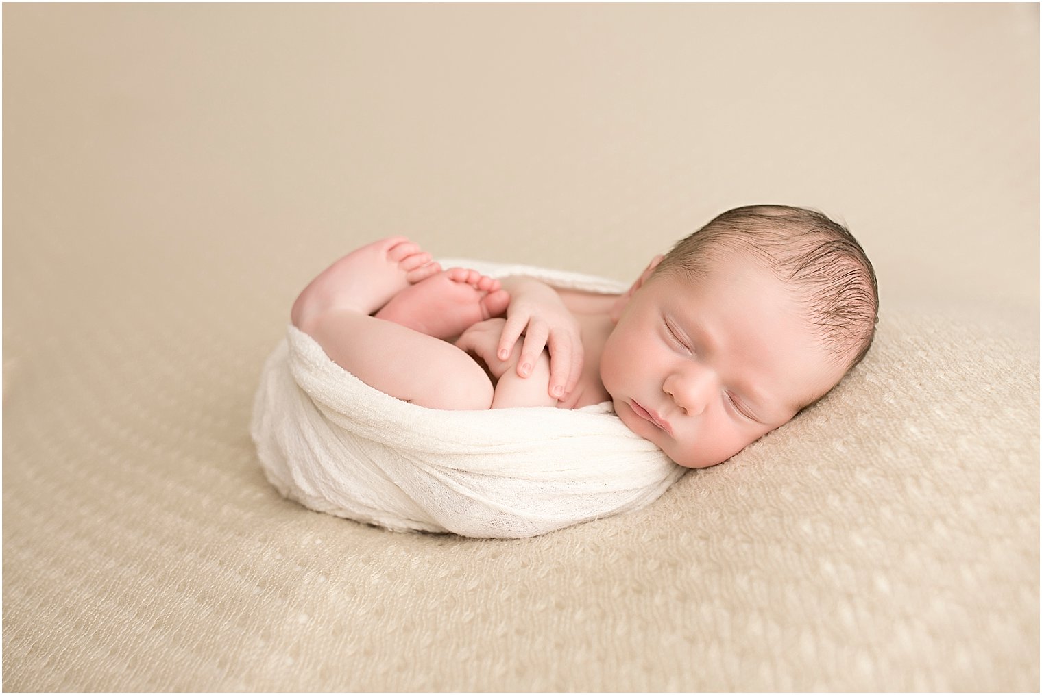 Wrapped newborn boy
