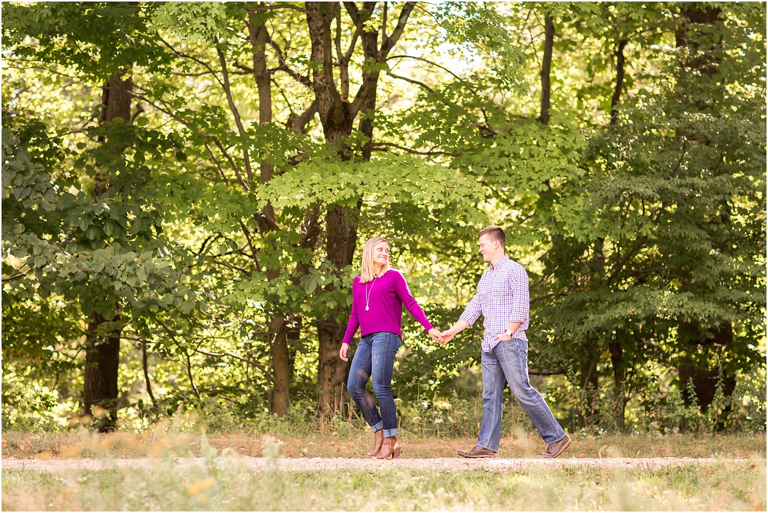 Bride and groom walking in the woods