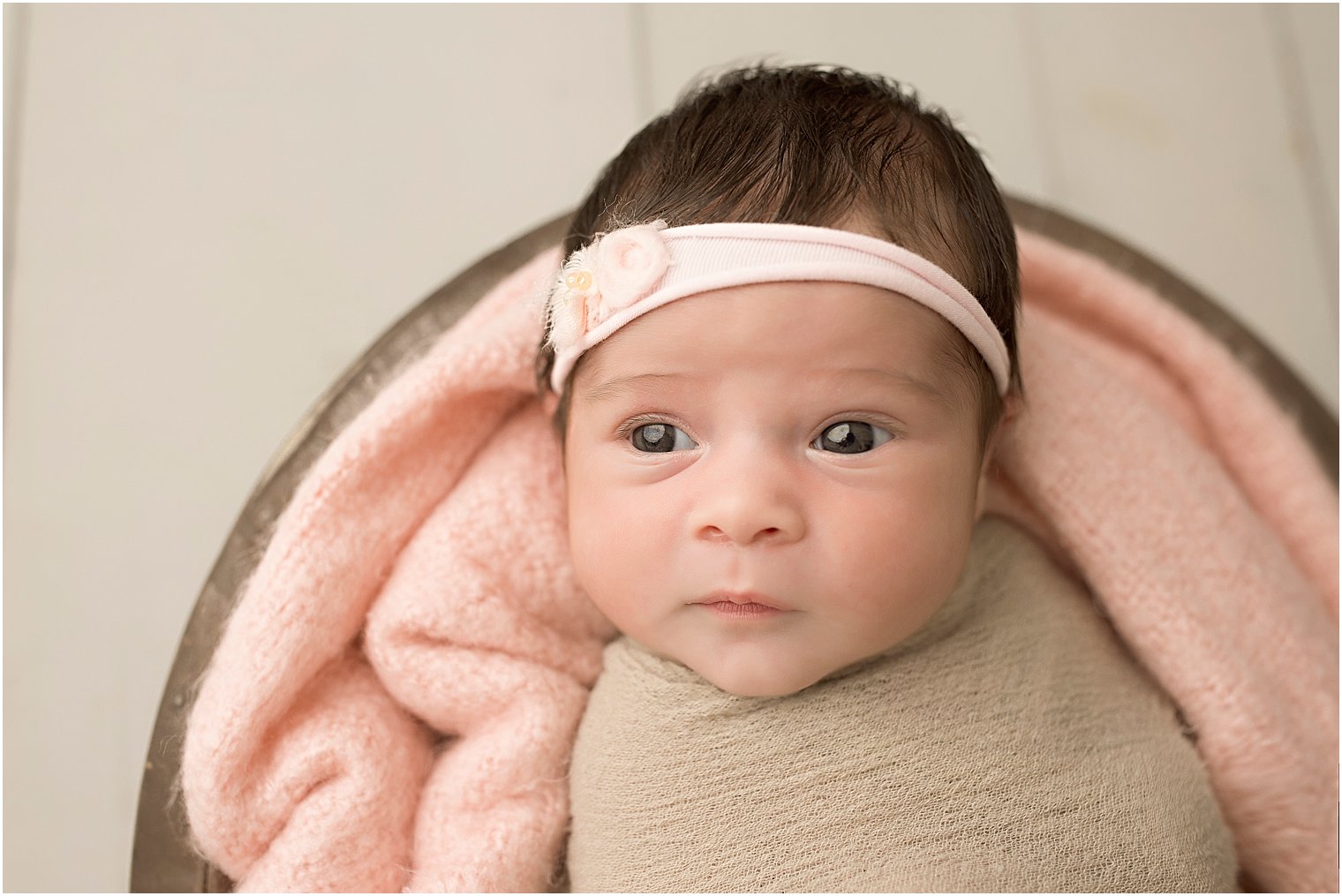 Alert baby girl in pink and tan