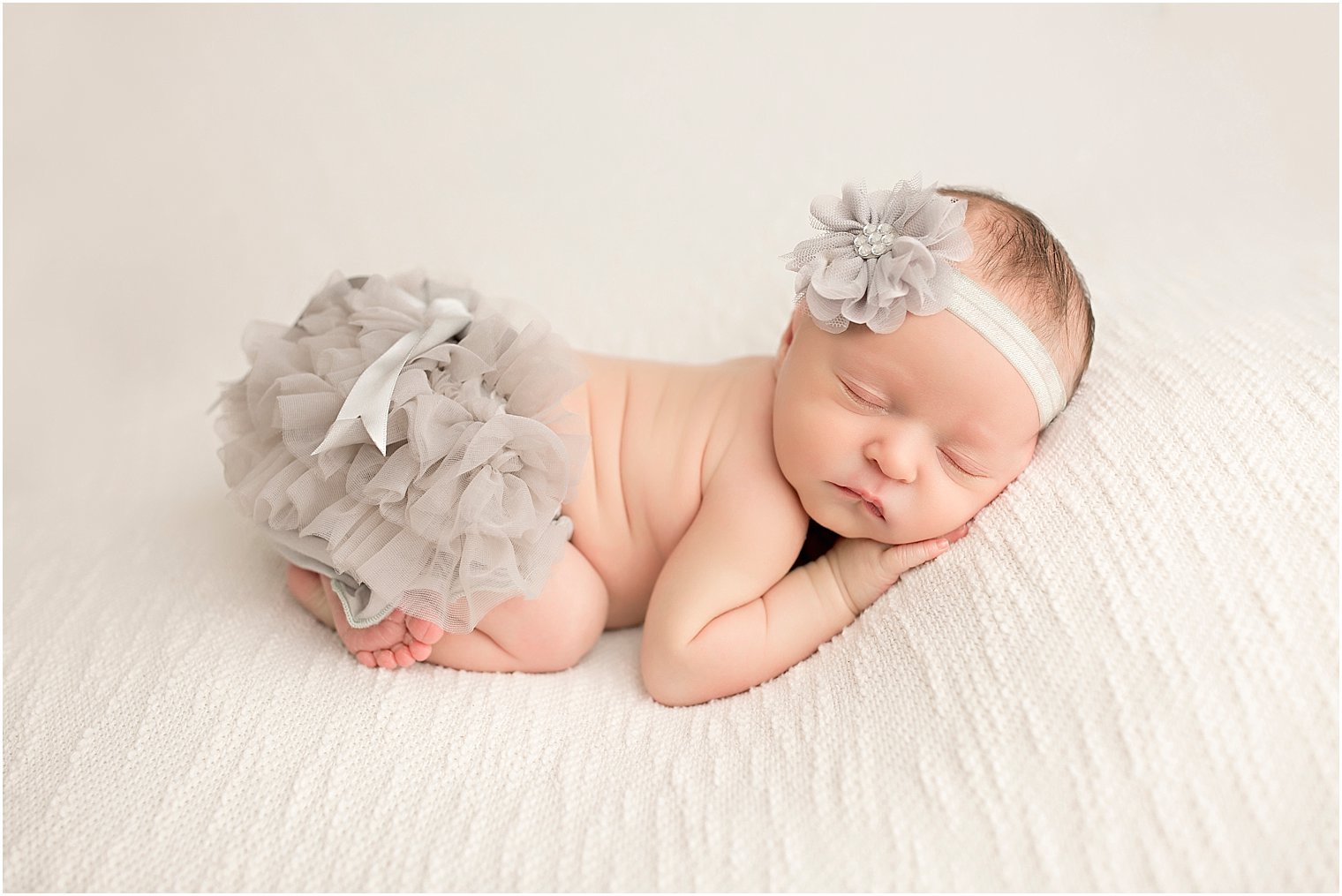 Brick NJ Newborn Photos of baby in gray bloomers