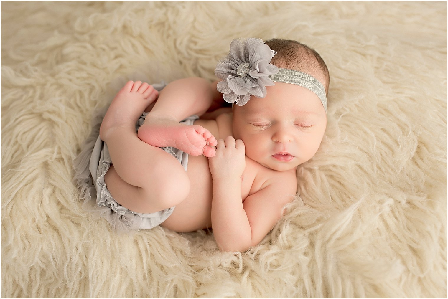 Baby in cream and gray