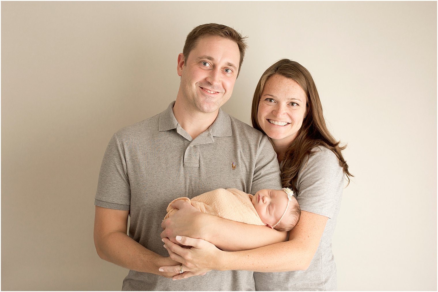 Newborn baby and her parents