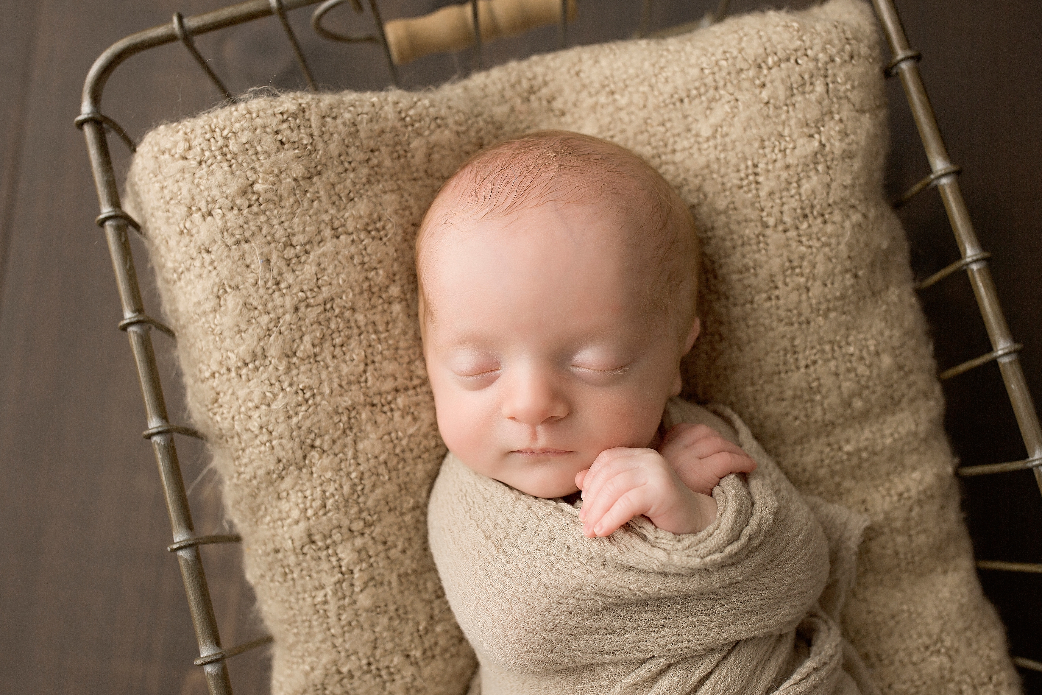 Newborn baby in a basket