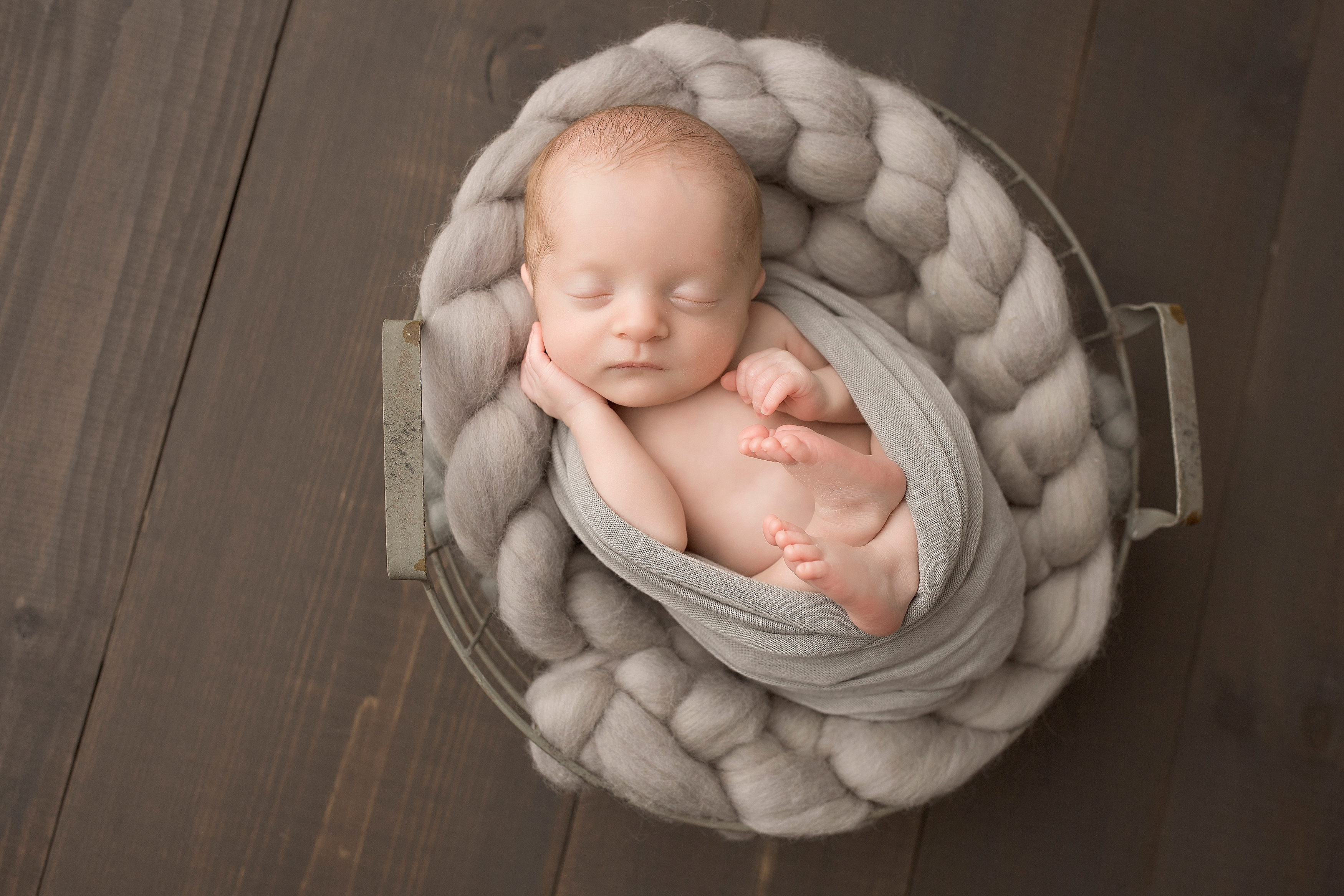 Baby boy in a basket